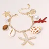 Fashnzfab Pearl Paved Starfish Puka Shell Peal Charm Station Chain Bracelet Cream, Gold In Multi
