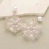 Fashnzfab Pearl Pointed Stone Paved Snowflake Pom Pom Dangle Earrings In Gold