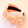 Fashnzfab Pearl Round Stone Embellished Knot Burnout Headband In Orange
