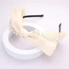 Fashnzfab Pearl Stone Embellished Bow Headband In Multi