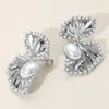 Fashnzfab Pearl Trimmed Fan Clip On Earrings In Silver