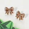 Fashnzfab Resin Football Bow Stud Earrings - Brown In Brown