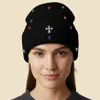 Fashnzfab Rhinestone Cross Accent Teardrop Stone Cluster Embellished Knit Beanie Hat In Multi