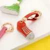 Fashnzfab Rhinestone Pave Sneaker Keychain In Orange