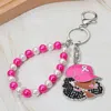 Fashnzfab Rhinestone Paved Cool Afro Woman In Awareness Pink Ribbon Cap Beaded Wristlet Keychain / Bag Charm In Black