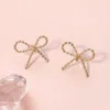 Fashnzfab Rope Brass Metal Wire Bow Knot Stud Earrings - Gold In Gold