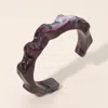 Fashnzfab Sculptural Marbled Resin Cuff Bracelet In Black
