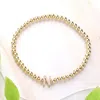 Fashnzfab Secret Box_ N Monogram Initial Stretch Bracelet Gold In Gold