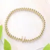 Fashnzfab Secret Box_ V Monogram Initial Stretch Bracelet Gold In Gold