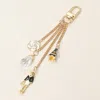 Fashnzfab Secret Box_pearl Enamel Flower Eiffel Tower Lady Stone Charm Drop Chain Bag Charm / Keychain In Gold
