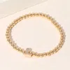 Fashnzfab Secret Box_stone Paved Boot Brass Ball Beaded Stretch Bracelet Gold In Gold