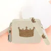 Fashnzfab Seed Beaded Crown Accented Rectangle Tassel Crossbody Bag In White