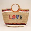 Fashnzfab Seed Beaded Love Message Pointed Wooden Handle Jute Handbag In Multi