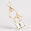 Fashnzfab Semi Precious Lock Keychain / Bag Charm In Gold