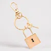 Fashnzfab Semi Precious Lock Keychain / Bag Charm In Gold
