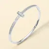 Fashnzfab Silver Plated Cz Stone Paved T-bar Hinged Bangle Bracelet In Silver