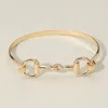 Fashnzfab Sleek Metal Equestrian Inspired Horsebit Bangle Bracelet Gold In Gold