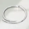 Fashnzfab Sleek Metal Hinged Open Coil Choker Necklace In Metallic