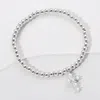 Fashnzfab Stainless Steel Ball Pearl Cross Charm Beaded Stretch Bracelet Clear, Silver In Multi