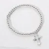 Fashnzfab Stainless Steel Cross Charm Beaded Stretch Bracelet Silver In Silver