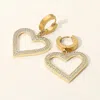 Fashnzfab Stainless Steel Cz Stone Paved Open Heart Charm Dangle Huggie Earrings In Gold