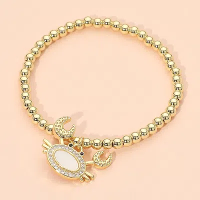 Fashnzfab Stainless Steel Mother Of Pearl Cz Stone Paved Crab Charm Beaded Stretch Bracelet In Gold
