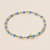 Fashnzfab Stainless Steel Seed Beaded Stretch Bracelet In Gold