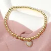 Fashnzfab Stainless Steel Stone Paved Heart Charm Beaded Stretch Bracelet In Gold