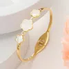 Fashnzfab Stainless Steel Triple Mother Of Pearl Quatrefoil Stone Bezel Pointed Hinged Bangel Bracelet Gold, M In Multi