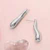 Fashnzfab Stainless Steel Wavy Long Teardrop Earrings In Silver