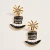 Fashnzfab Starburst Accent Enamel Happy New Year Hat Dangle Earrings In Gold
