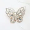 Fashnzfab Stone Cluster Butterfly Pin Brooch In Metallic