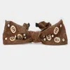 Fashnzfab Stone Embellished Open Metal Circle Link Bow Headband In Brown