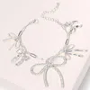 Fashnzfab Stone Paved Bow Metal Bow Charm Station Paperclip Chain Bracelet Clear, Rhodium In Multi