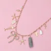 Fashnzfab Stone Paved Bow Metal Starfish Fish Shell Pearl Tropical Leaf Charm Station Necklace In Multi