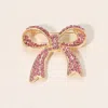 Fashnzfab Stone Paved Bow Pin Brooch In Multi