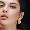 Fashnzfab Stone Paved Curved Teardrop Earrings - Gold, Pink In Multi