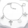 Fashnzfab Stone Paved Flower Bow Butterfly Quatrefoil Charm Station Bracelet Cream, Silver In Multi