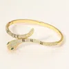 Fashnzfab Stone Paved Snake Hinged Bangle Bracelet Gold In Gold
