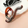 Fashnzfab Stone Paved Wavy Open Frame Hair Claw Clip In Brown