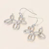 Fashnzfab Textured Metal Open Balloon Dog Dangle Earrings In Silver