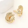 Fashnzfab Textured Metal Swirl Clip On Earrings In Gold