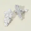 Fashnzfab Textured Metal Triple Flower Drop Clip On Earrings In Metallic