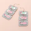 Fashnzfab The Best Nurse Message Pill Case Link Dropdown Dangle Earrings In Multi