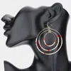 Fashnzfab Tiny Beaded Triple Open Circle Layered Dangle Earrings In Red