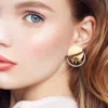 Fashnzfab Triple Ring Linked Metal Disc Metal Hoop Earrings In Gold