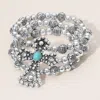 Fashnzfab Turquoise Stone Accented Antique Metal Cross Metal Ball Beaded Triple Layered Stretch Bracelet In Multi