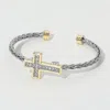 Fashnzfab Two Tone Cz Stone Paved Cross Accent Braided Cuff Bracelet Two Tone In Metallic