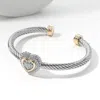 Fashnzfab Two Tone Stone Paved Heart Cluster Pointed Twisted Metal Cuff Bracelet Two Tone In Multi
