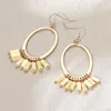 Fashnzfab Wooden Charm Hanging Open Oval Dangle Earrings - Ivory In Gold